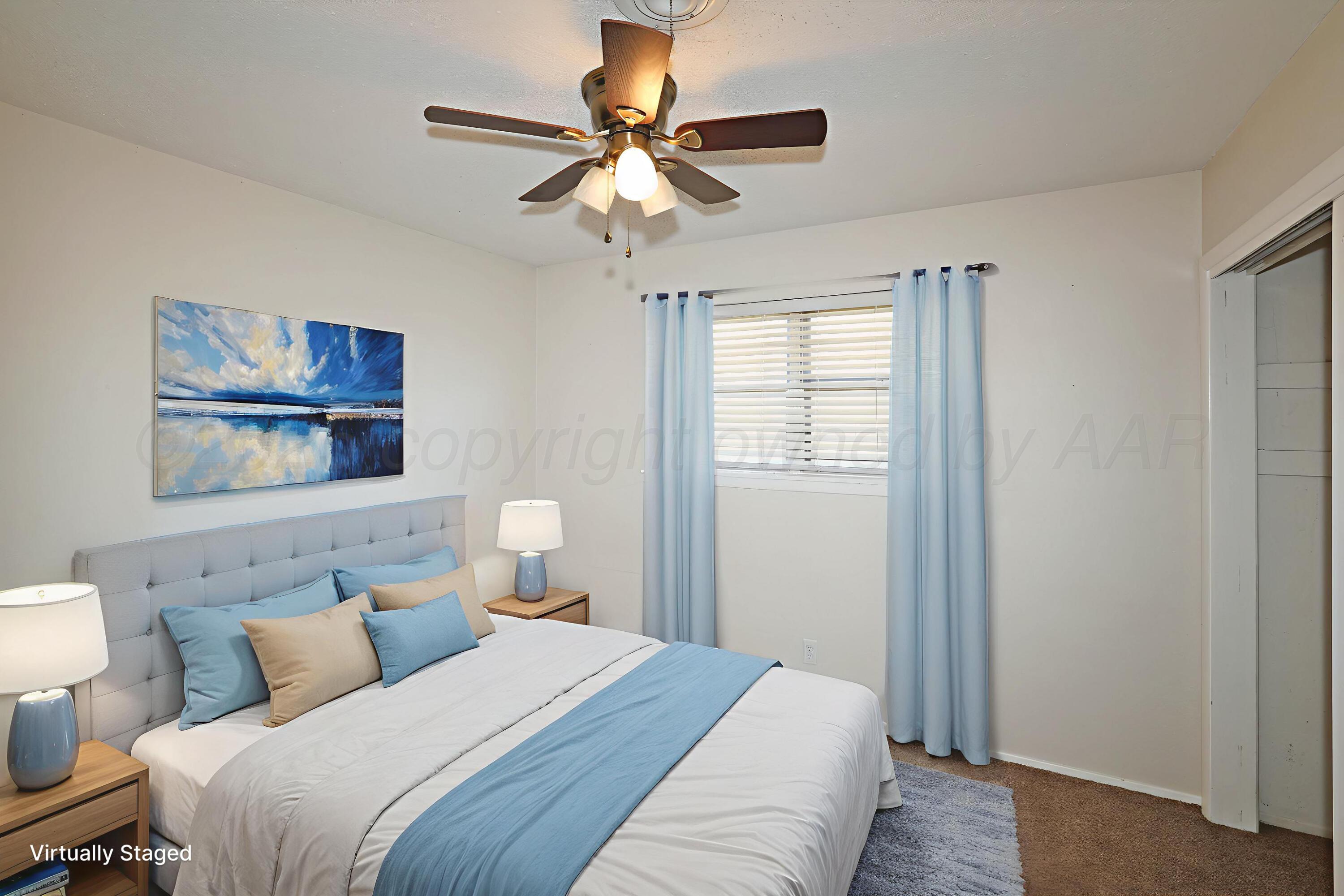 5811 Oregon Trail Amarillo, TX 79109 - Photo 18 of 22 a bedroom with a bed and a window