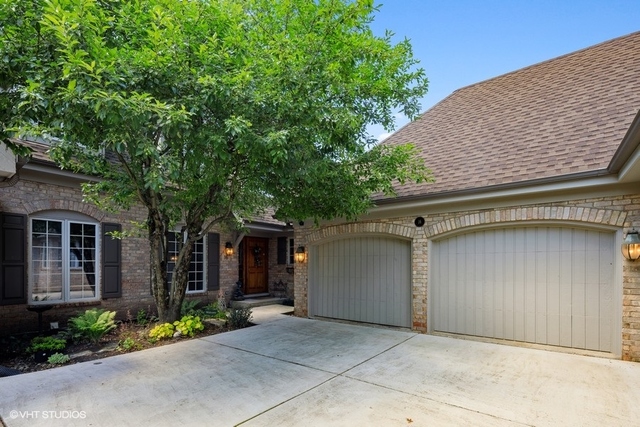 16 Tartan Ridge Road Burr Ridge, IL 60527 - Photo 1 of 30 a front view of a house with a garden