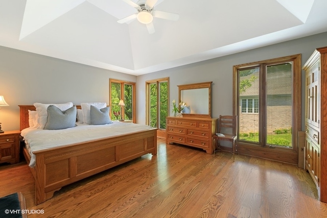 16 Tartan Ridge Road Burr Ridge, IL 60527 - Photo 11 of 30 a bedroom with a bed and large window