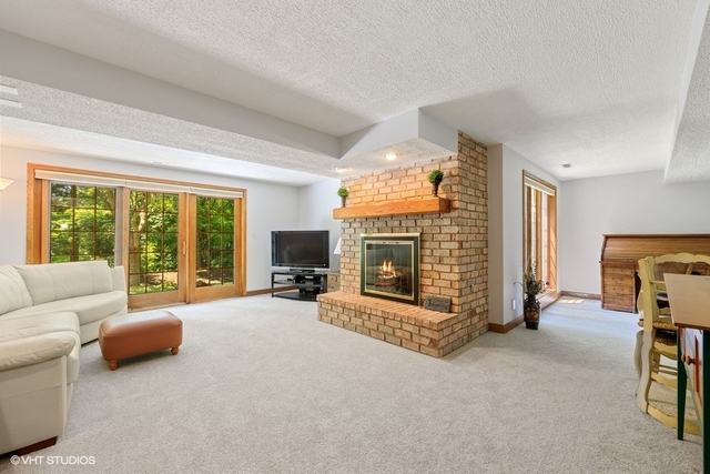 16 Tartan Ridge Road Burr Ridge, IL 60527 - Photo 20 of 30 a living room with furniture and a fireplace