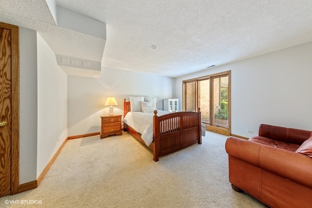 16 Tartan Ridge Road Burr Ridge, IL 60527 - Photo 21 of 30 a bedroom with bed couch and a larger window