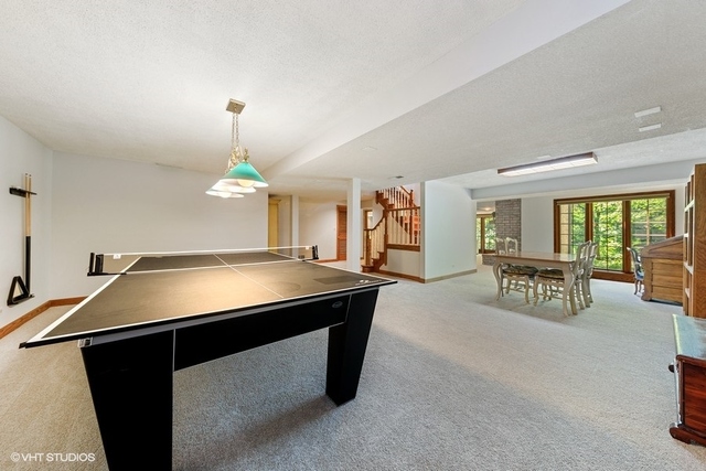 16 Tartan Ridge Road Burr Ridge, IL 60527 - Photo 22 of 30 a room with pool table and window