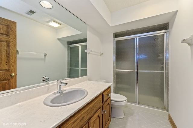 16 Tartan Ridge Road Burr Ridge, IL 60527 - Photo 23 of 30 a bathroom with a granite countertop sink toilet and shower
