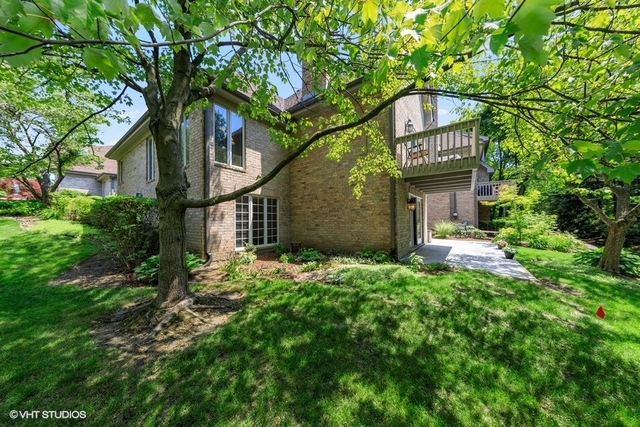 16 Tartan Ridge Road Burr Ridge, IL 60527 - Photo 26 of 30 a front view of a house with a yard and large trees