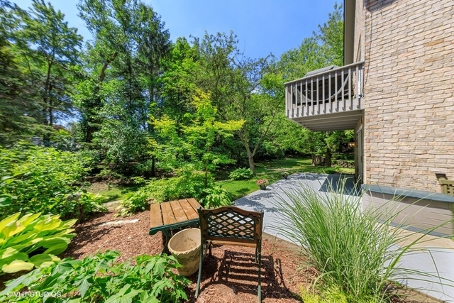 16 Tartan Ridge Road Burr Ridge, IL 60527 - Photo 27 of 30 a view of a chair and tables in the backyard