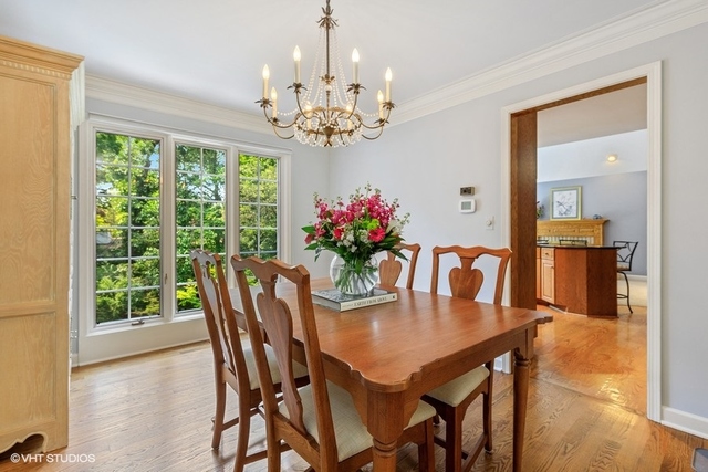 16 Tartan Ridge Road Burr Ridge, IL 60527 - Photo 5 of 30 a dining room with furniture a large window and wooden floor