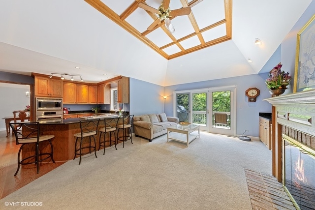 16 Tartan Ridge Road Burr Ridge, IL 60527 - Photo 7 of 30 a living room with furniture a fireplace and a large window