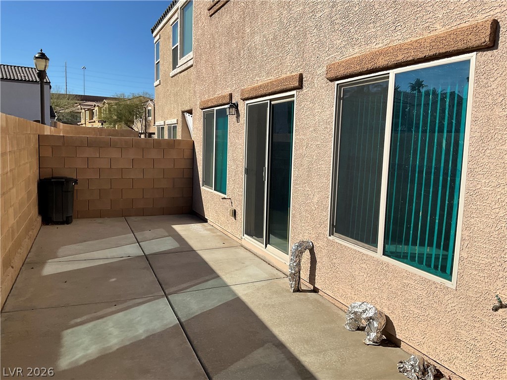 12 Jasmine Point Street Henderson, NV 89074 - Photo 15 of 15 A private backyard patio offers sun-drenched outdoor living.