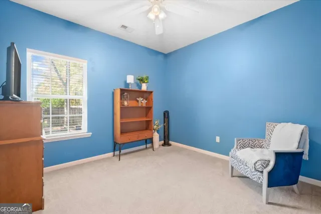 a bedroom with furniture and a window