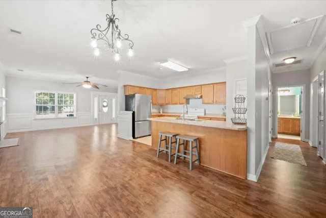 a view of a kitchen and dining room