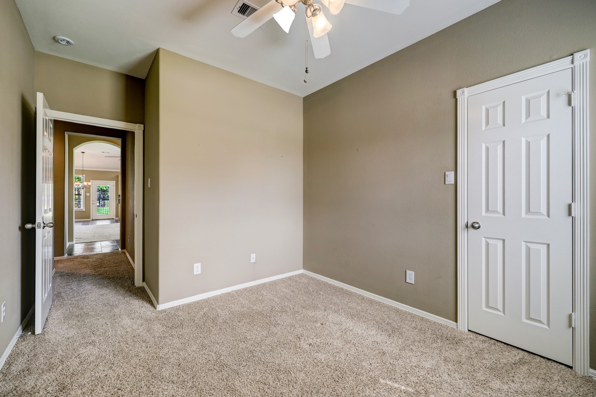 18618 Jaya Loch Court Spring, TX 77379 - Photo 14 of 18 a view of an empty room with a chandelier fan