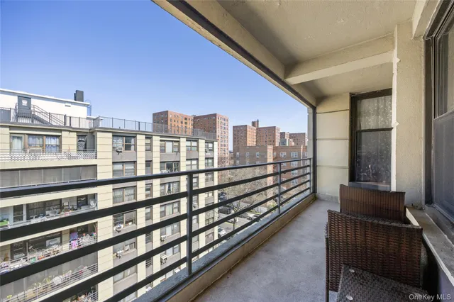 a view of kitchen with furniture and windows