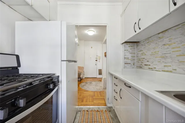 a view of a living room and bathroom