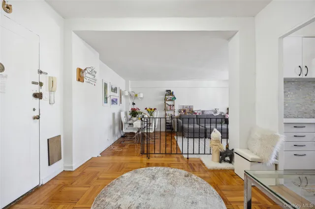 a bedroom with furniture and a flat screen tv