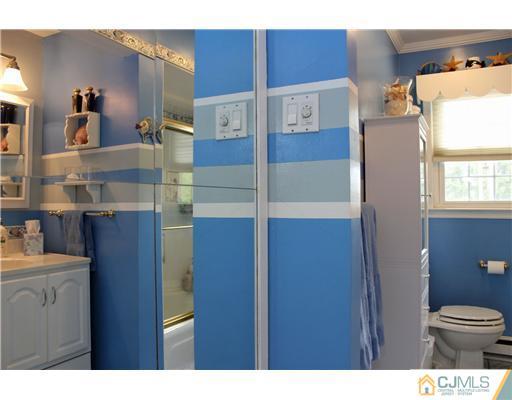 687 Old Post Road Edison, NJ 08817 - Photo 14 of 20 a bathroom with a toilet and a shower