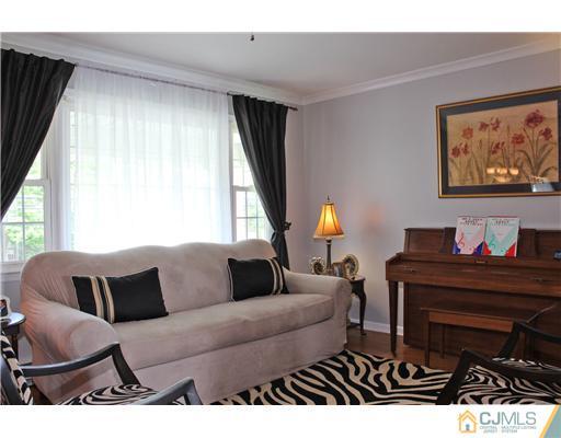 687 Old Post Road Edison, NJ 08817 - Photo 3 of 20 a living room with furniture and a large window