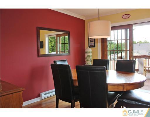 687 Old Post Road Edison, NJ 08817 - Photo 4 of 20 a view of a dining room with furniture and a window