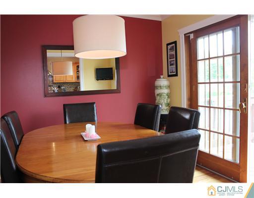 687 Old Post Road Edison, NJ 08817 - Photo 5 of 20 a living room with furniture a table and chair