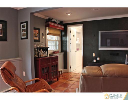 687 Old Post Road Edison, NJ 08817 - Photo 8 of 20 a living room with furniture and a flat screen tv