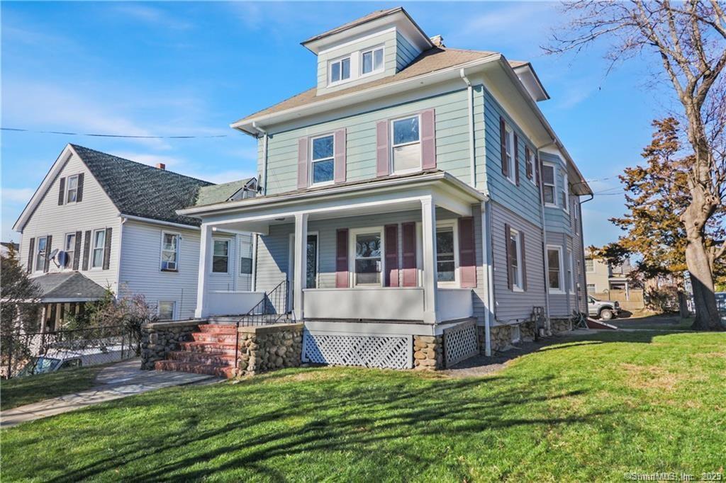37 Couch Street Norwalk, CT 06854 - Photo 1 of 1 a front view of house with yard and green space