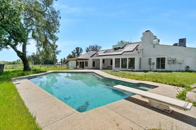 a view of a house with a swimming pool