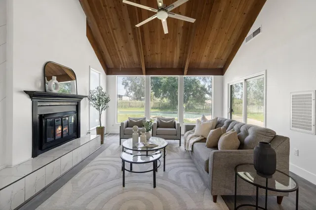 a living room with furniture and a fireplace