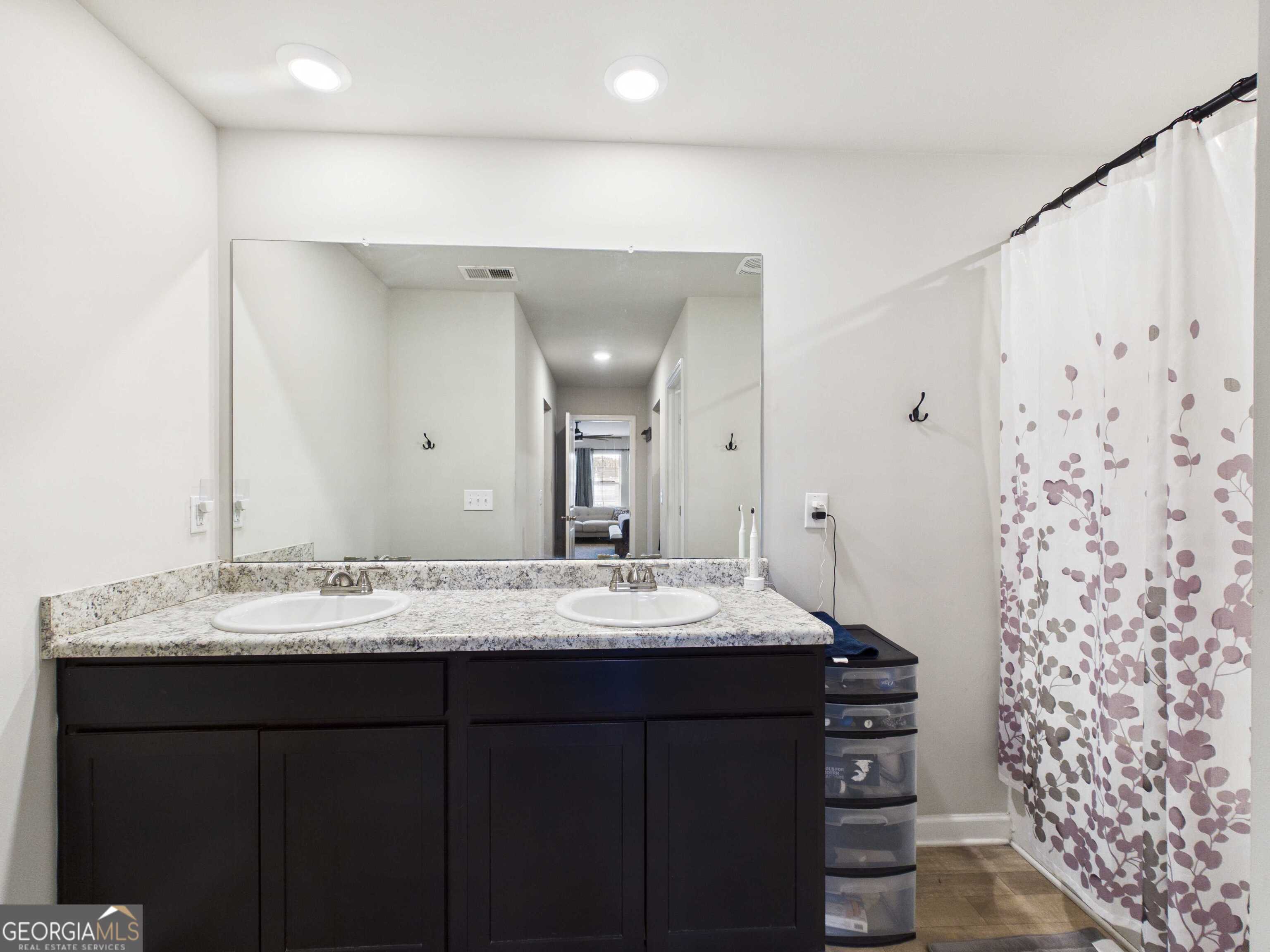 197 Stocks Circle West Point, GA 31833 - Photo 15 of 63 a bathroom with a sink and a mirror