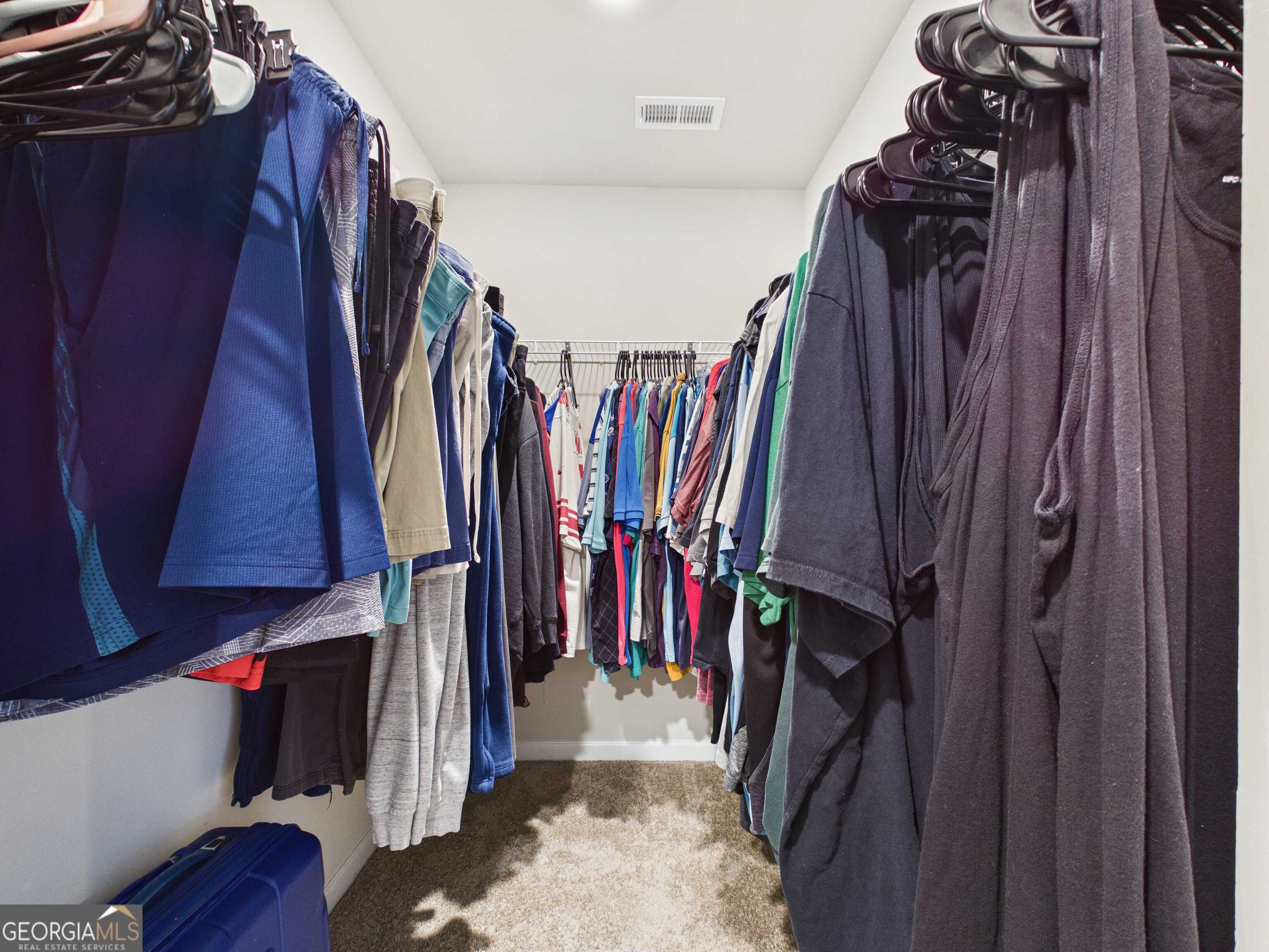 197 Stocks Circle West Point, GA 31833 - Photo 18 of 63 a view of walk in closet with clothes