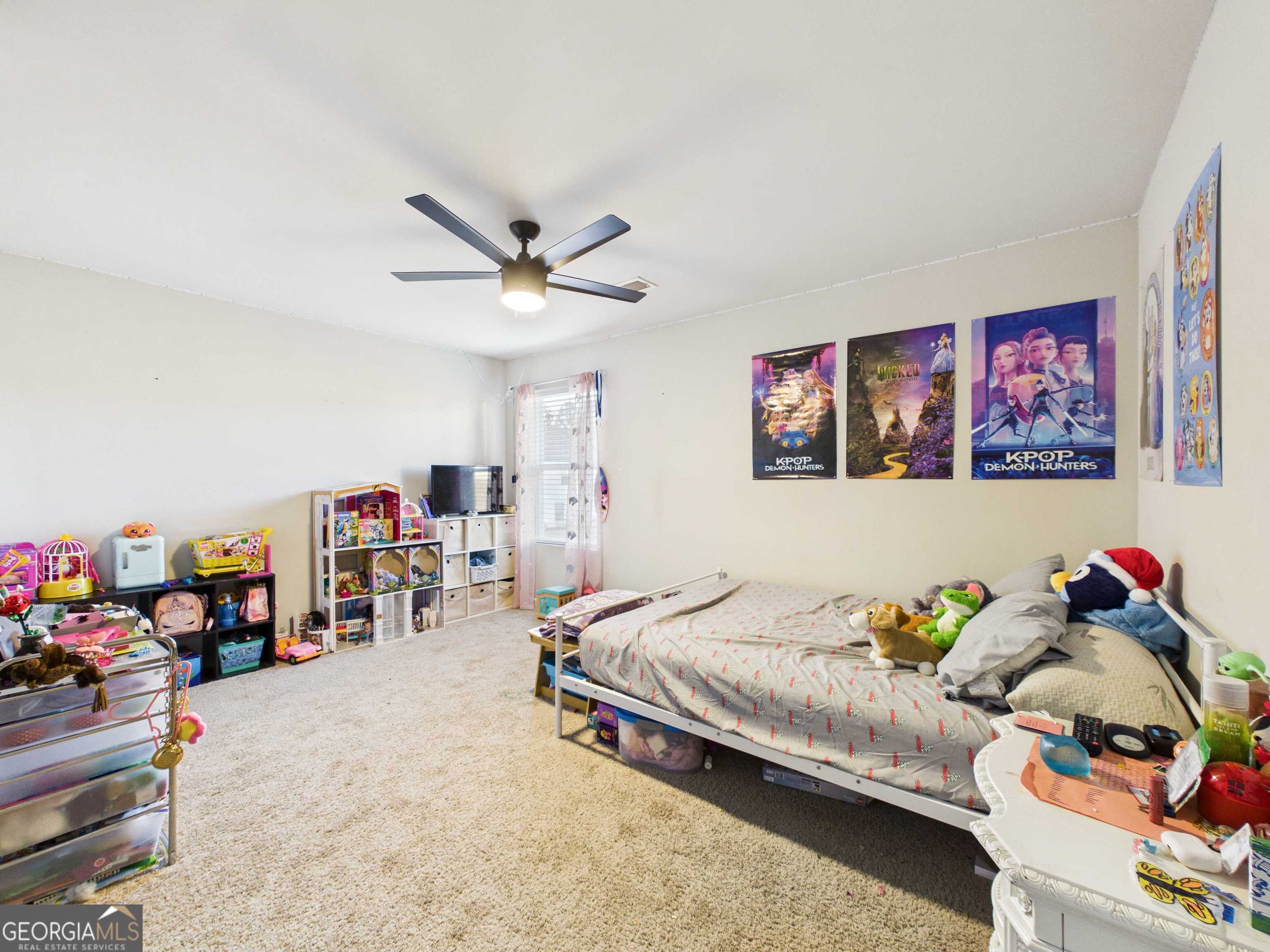 197 Stocks Circle West Point, GA 31833 - Photo 20 of 63 a bedroom with furniture and a chandelier