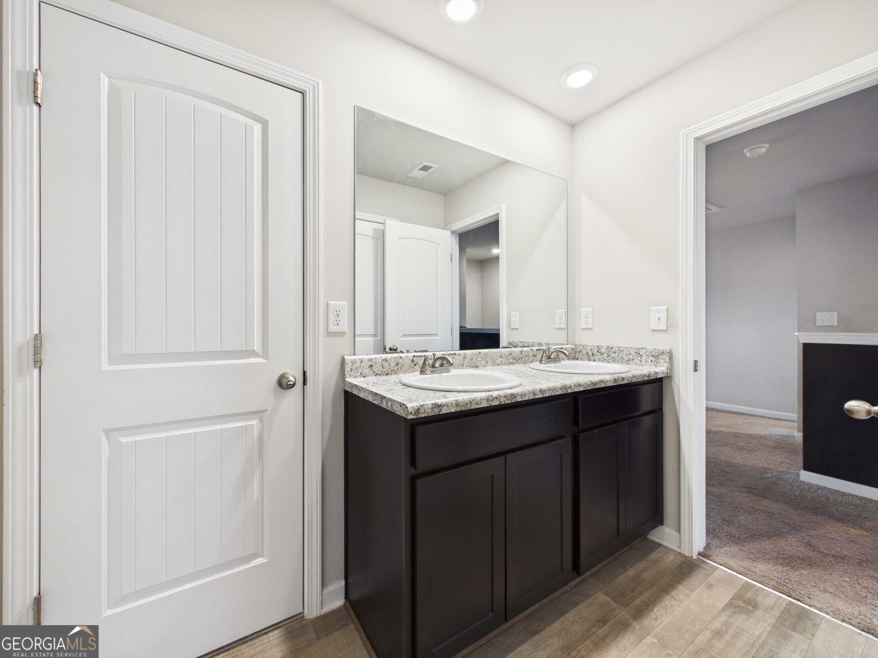 197 Stocks Circle West Point, GA 31833 - Photo 28 of 63 a bathroom with a sink and a mirror
