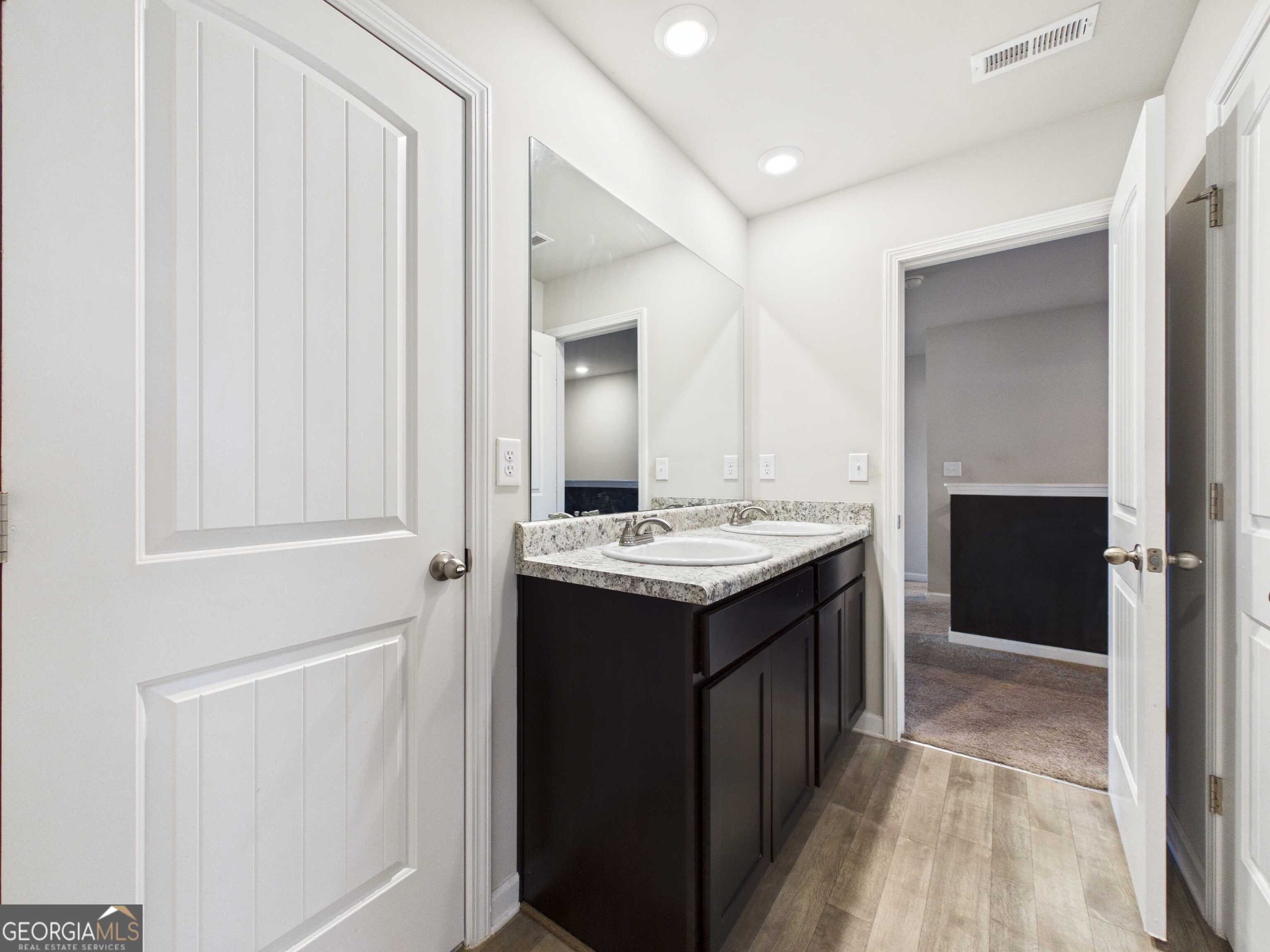 197 Stocks Circle West Point, GA 31833 - Photo 30 of 63 a bathroom with a sink and a mirror