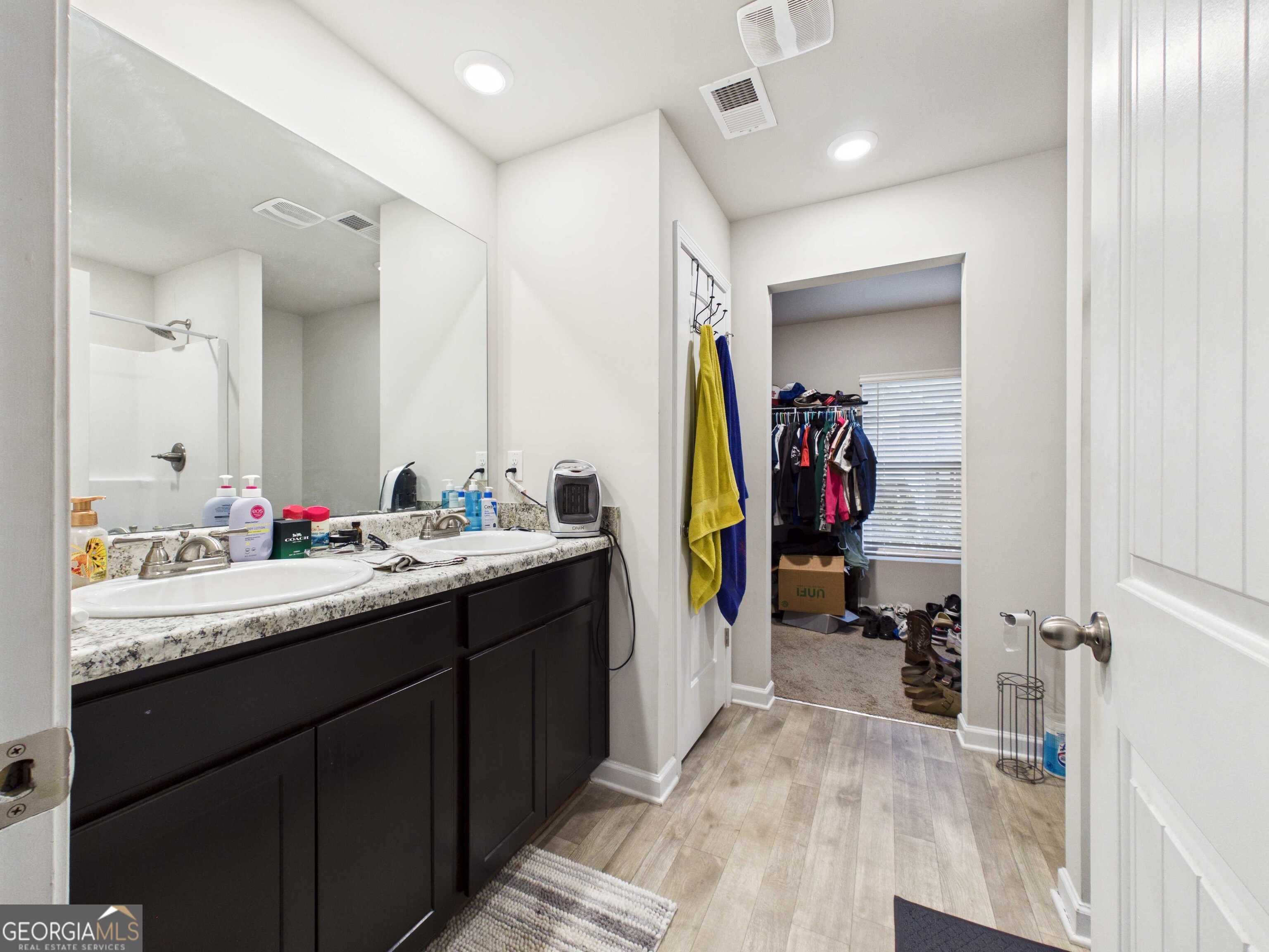 197 Stocks Circle West Point, GA 31833 - Photo 36 of 63 a bathroom with a sink double vanity and a mirror