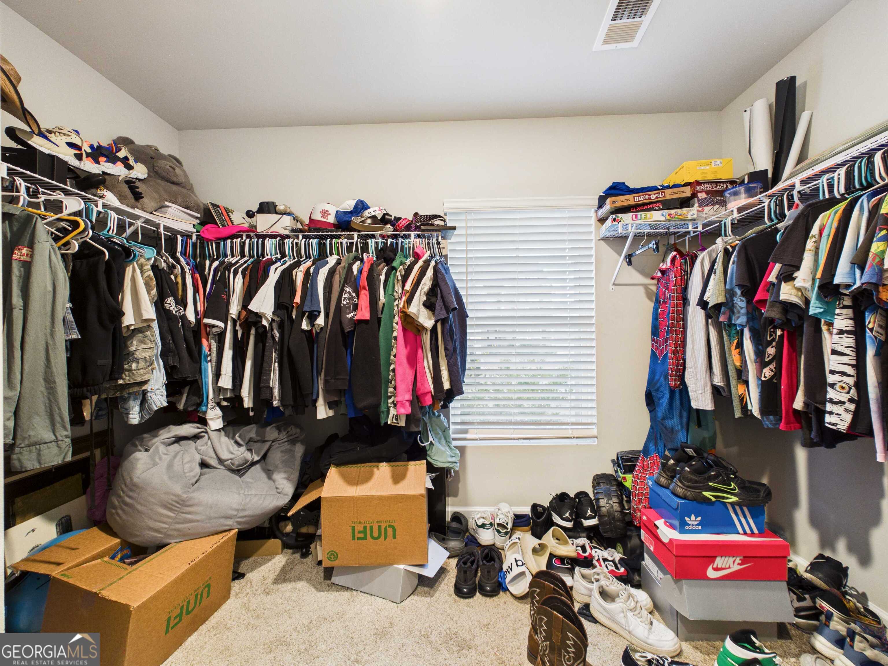 197 Stocks Circle West Point, GA 31833 - Photo 39 of 63 a view of walk in closet with clothes