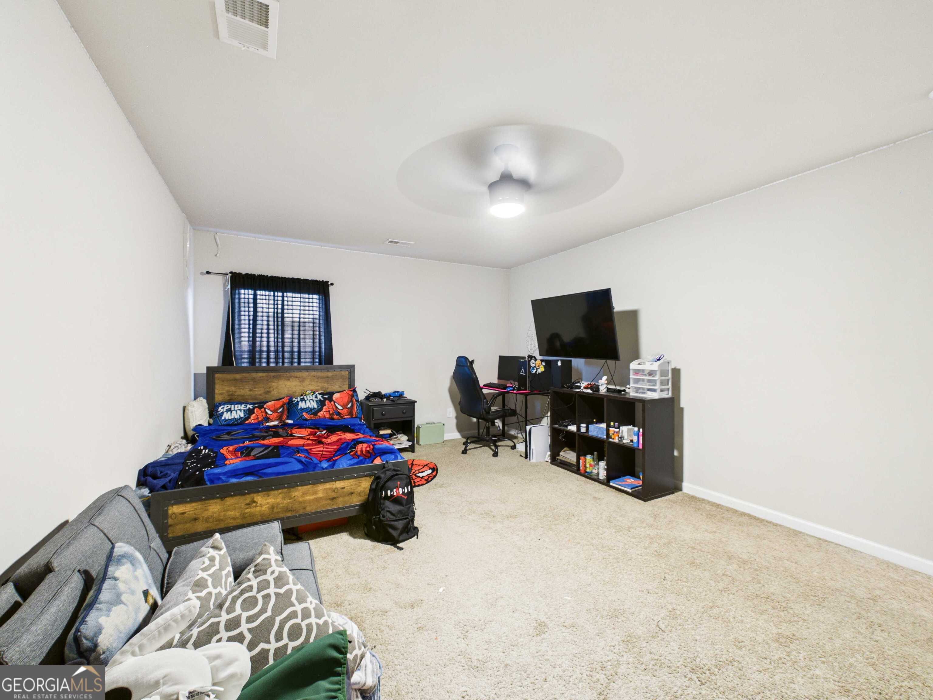 197 Stocks Circle West Point, GA 31833 - Photo 40 of 63 a bedroom with furniture and a flat screen tv