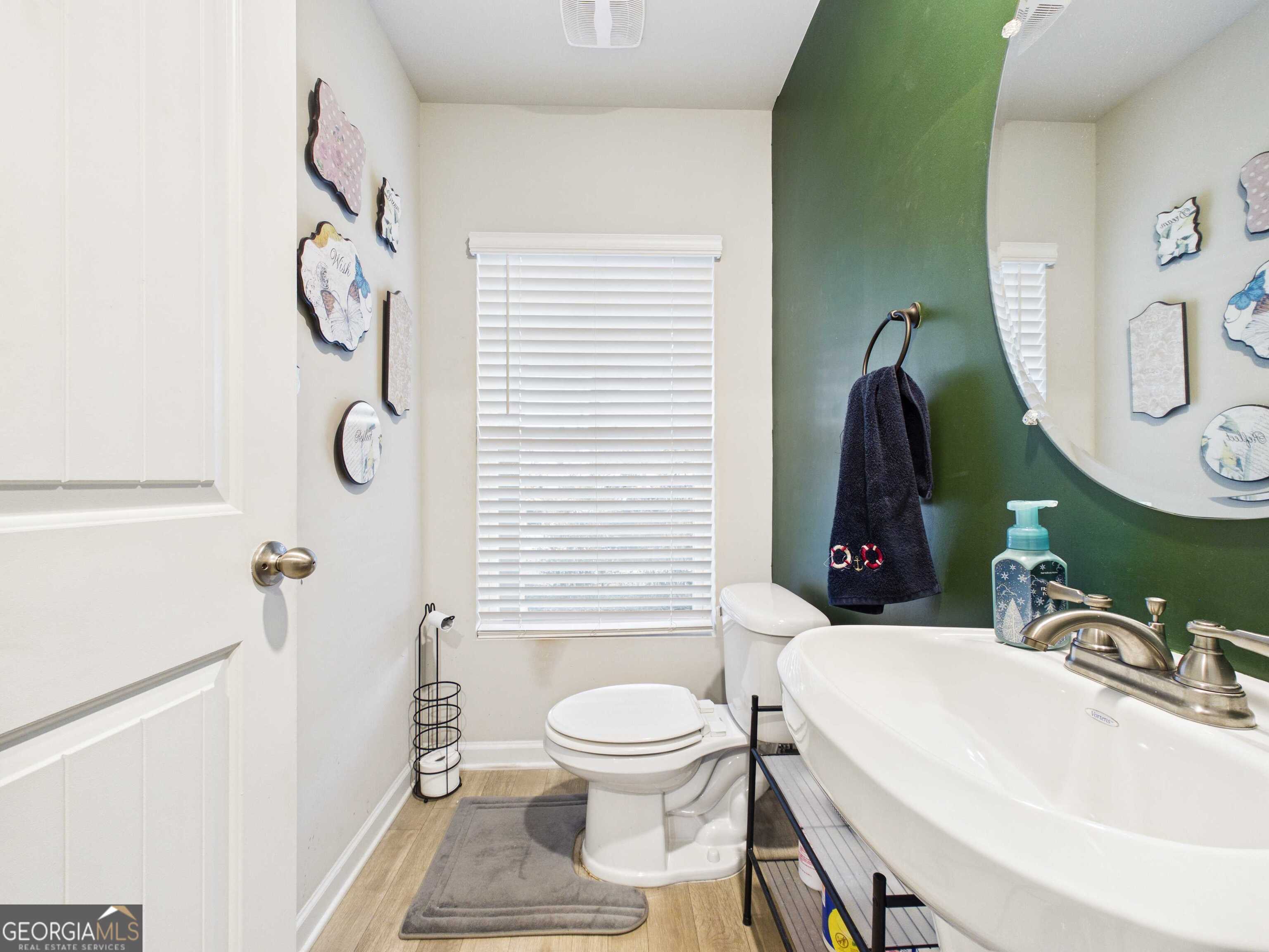 197 Stocks Circle West Point, GA 31833 - Photo 44 of 63 a bathroom with a toilet sink and mirror