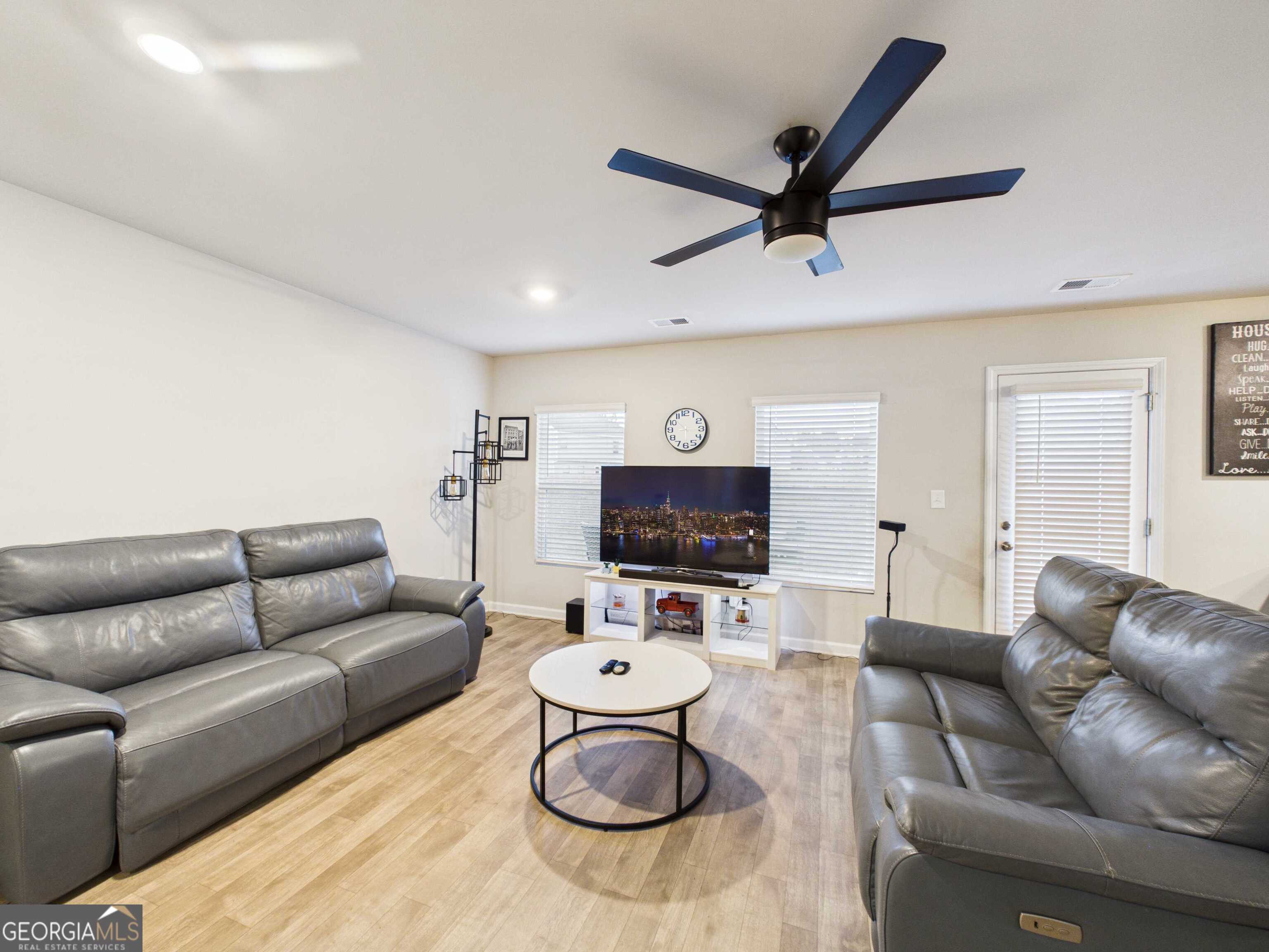 197 Stocks Circle West Point, GA 31833 - Photo 58 of 63 a living room with furniture a rug and a window