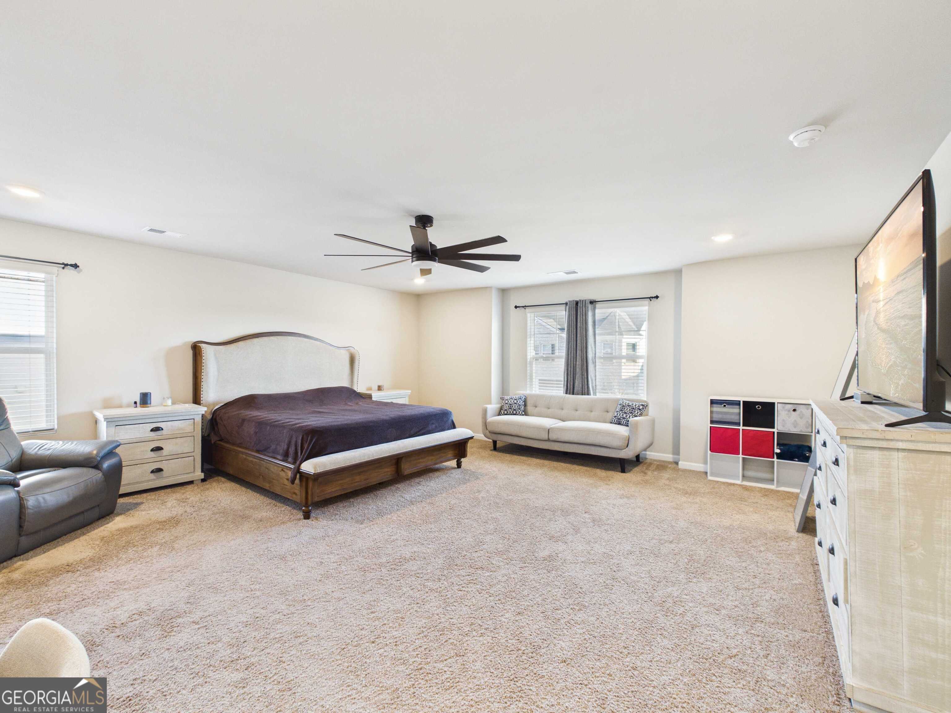 197 Stocks Circle West Point, GA 31833 - Photo 8 of 63 a bedroom with furniture and a flat screen tv