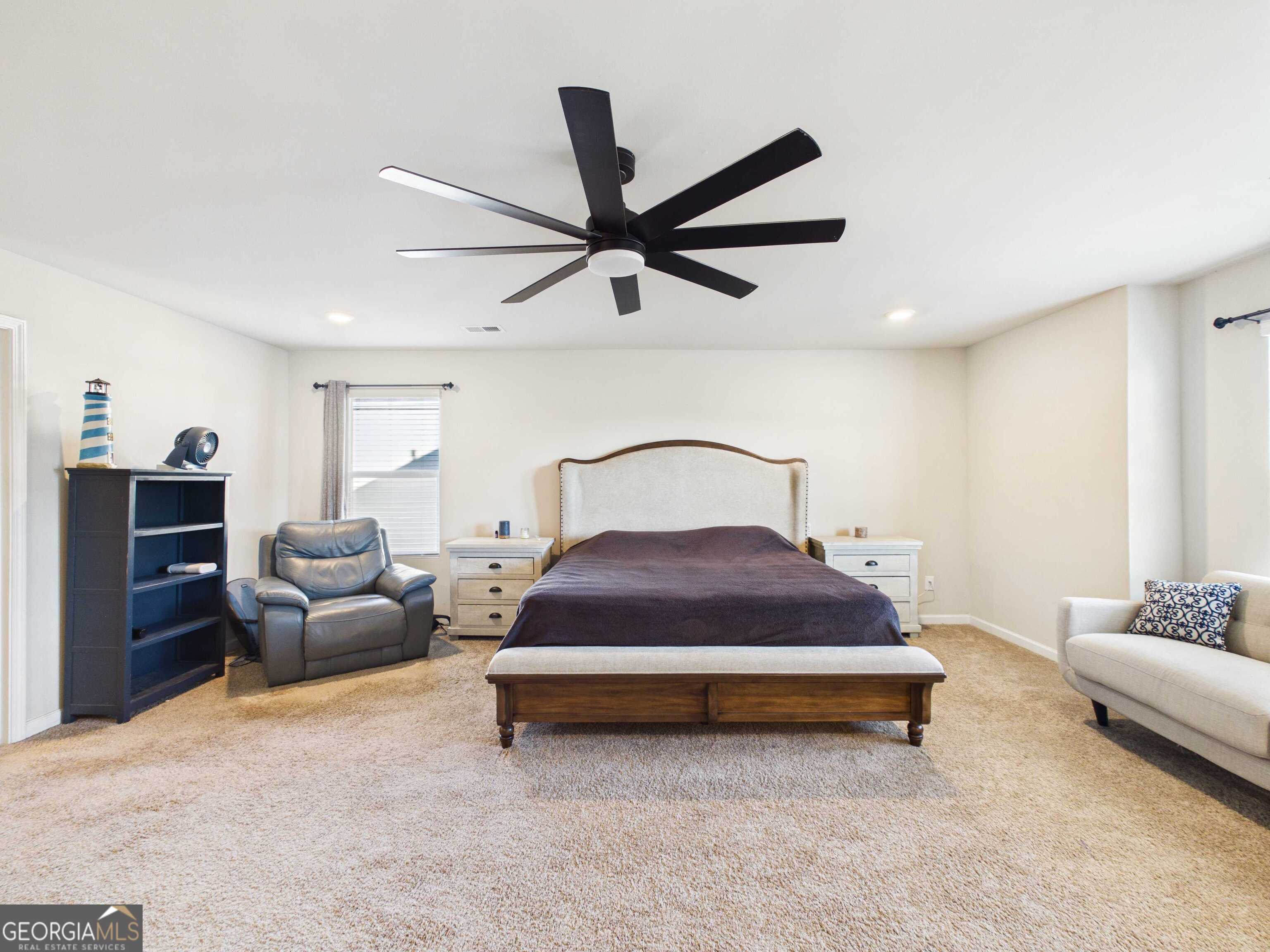 197 Stocks Circle West Point, GA 31833 - Photo 9 of 63 a bedroom with a bed and a couch