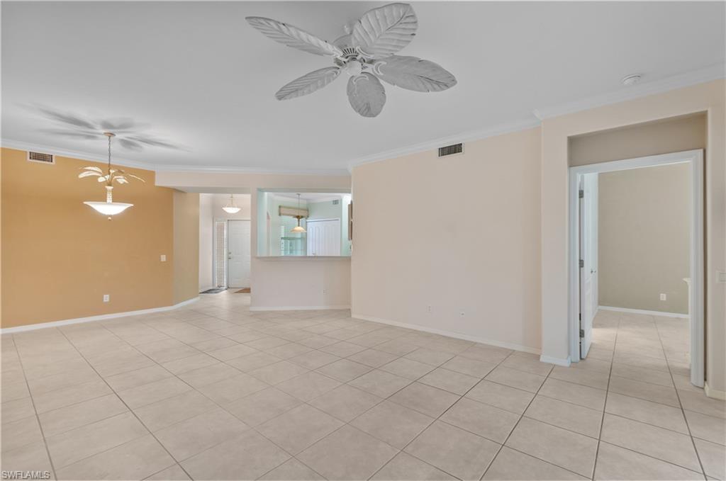 9341 Spring Run Boulevard, Unit 3106 Estero, FL 34135 - Photo 11 of 44 Unfurnished room with crown molding, light tile floors, and a ceiling fan