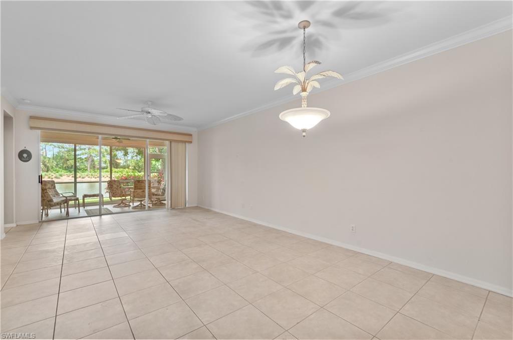 9341 Spring Run Boulevard, Unit 3106 Estero, FL 34135 - Photo 12 of 44 Unfurnished room with crown molding, light tile flooring, and ceiling fan