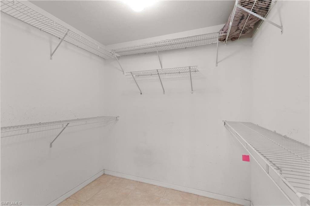 9341 Spring Run Boulevard, Unit 3106 Estero, FL 34135 - Photo 17 of 44 Walk in closet with light tile