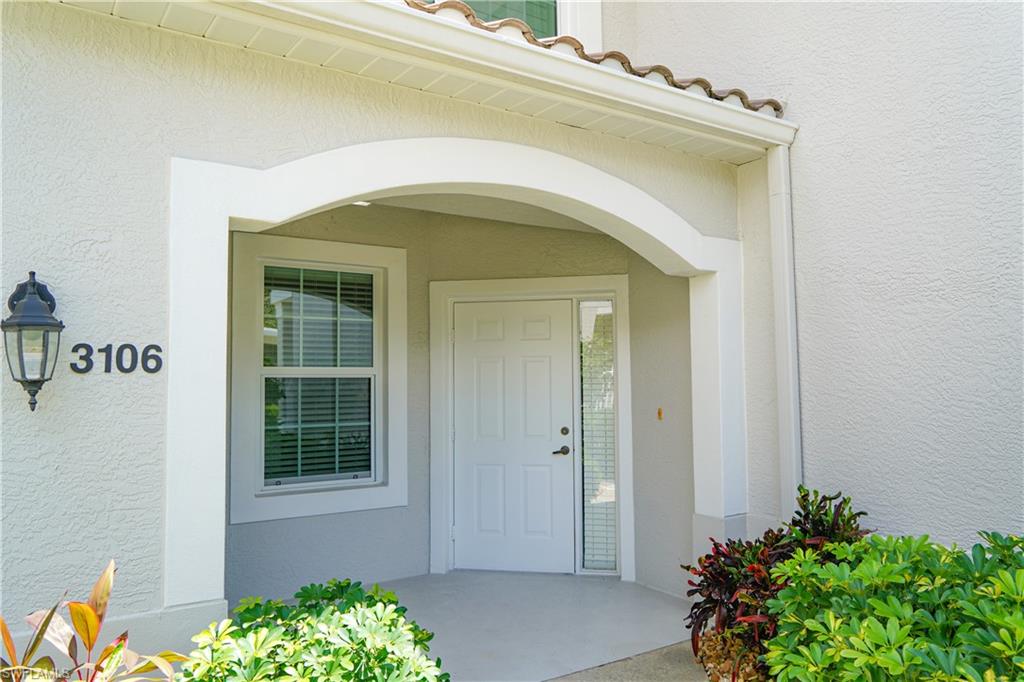 9341 Spring Run Boulevard, Unit 3106 Estero, FL 34135 - Photo 2 of 44 Property entrance with stucco siding and a tiled roof