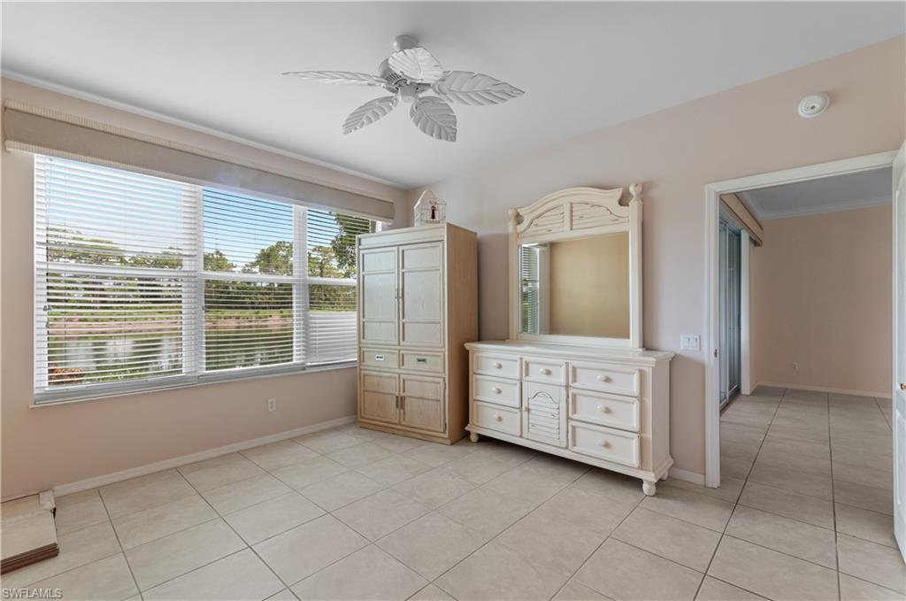 9341 Spring Run Boulevard, Unit 3106 Estero, FL 34135 - Photo 23 of 44 Unfurnished bedroom featuring light tile flooring and a ceiling fan