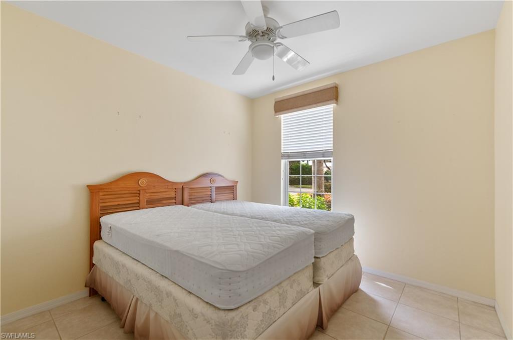 9341 Spring Run Boulevard, Unit 3106 Estero, FL 34135 - Photo 24 of 44 Bedroom featuring light tile floors and ceiling fan