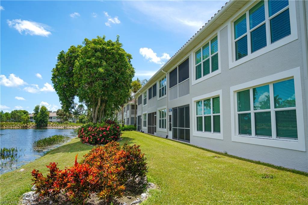 9341 Spring Run Boulevard, Unit 3106 Estero, FL 34135 - Photo 26 of 44 Lawn, a water view, and a lanai