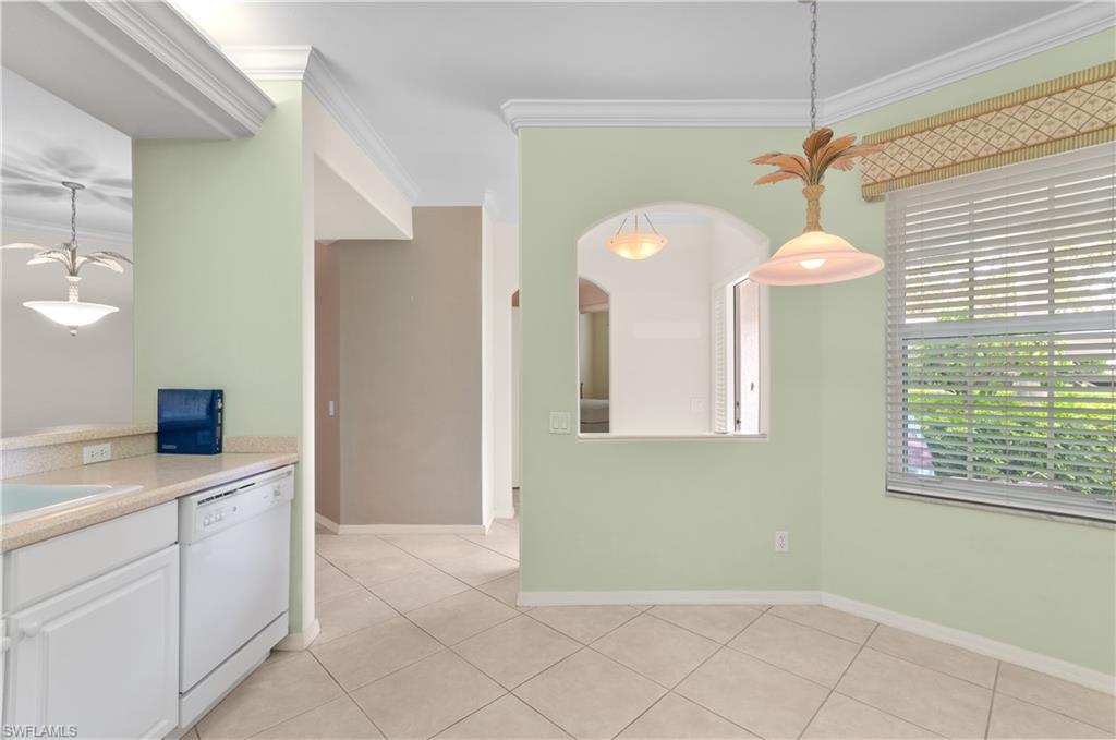 9341 Spring Run Boulevard, Unit 3106 Estero, FL 34135 - Photo 9 of 44 Kitchen featuring ornamental molding, pendant lighting, dishwasher, light tile flooring, and light countertops