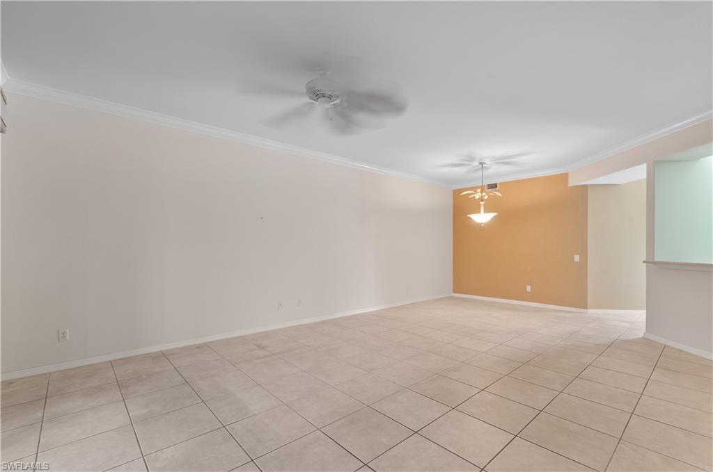 9341 Spring Run Boulevard, Unit 3106 Estero, FL 34135 - Photo 10 of 44 Unfurnished room featuring ornamental molding, light tile floors, and a ceiling fan