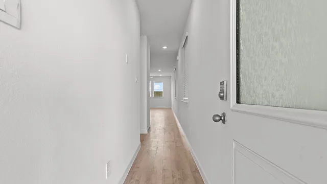 a view of a bathroom from the hallway