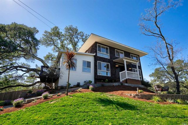 a front view of a house with a yard