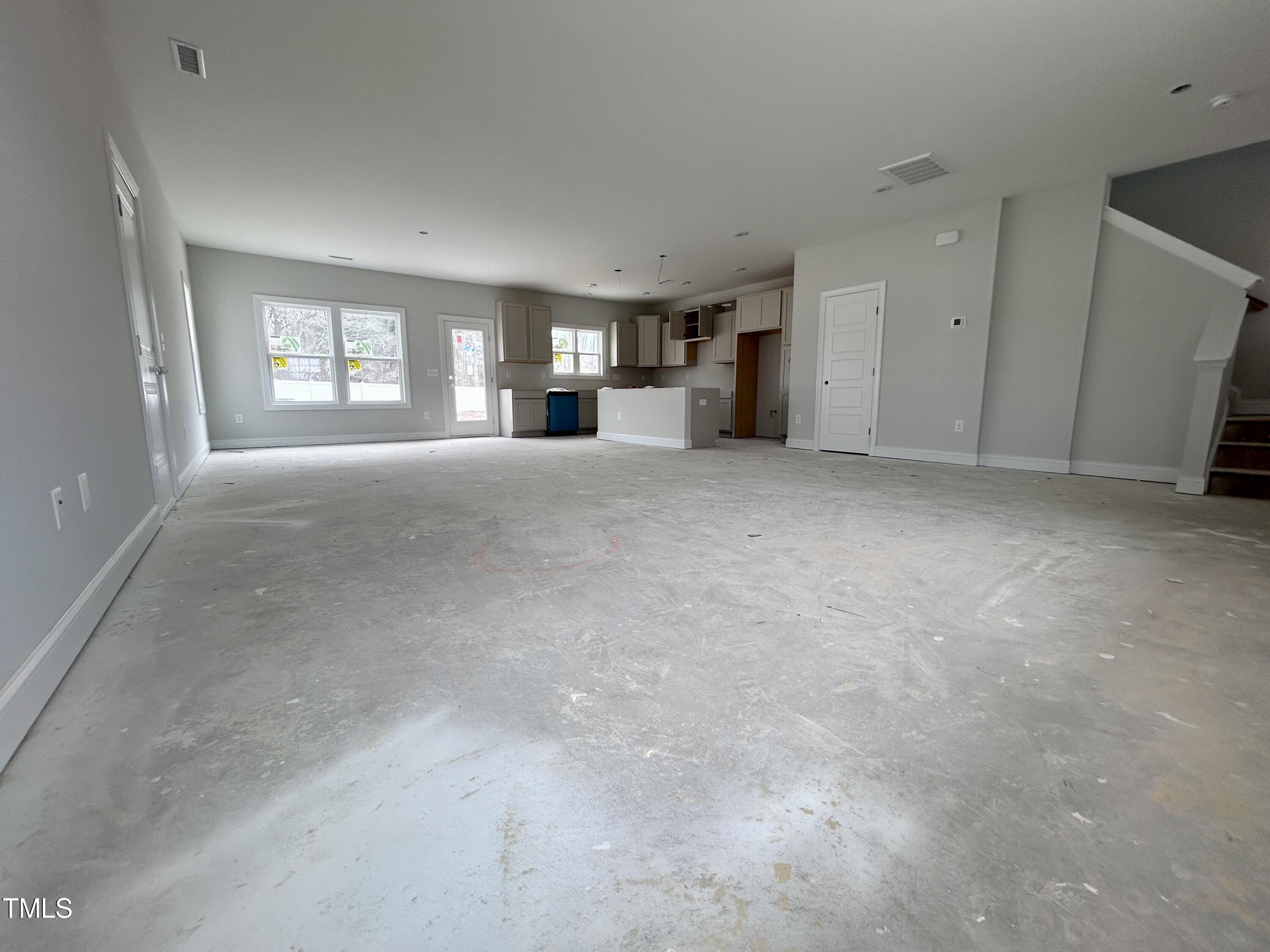 1208 Marsh Hawk Way Wake Forest, NC 27587 - Photo 2 of 11 a view of empty room with windows and cabinet